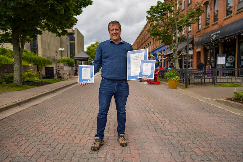 John Morris proudly stands in Victoria Row in Charlottetown. His photography was recognized for three ‘Atlantic Journalism Awards’ this year. - John Morris Photography

 - Saltwire network