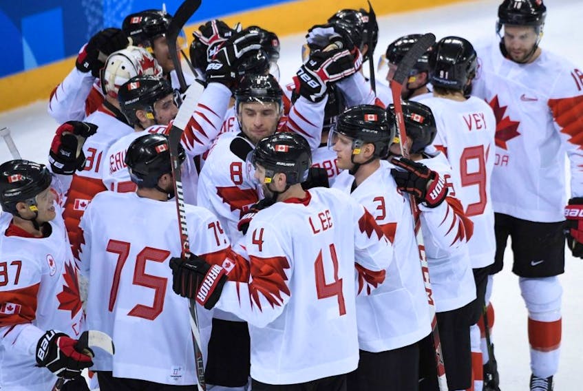 Canada's men's hockey team celebrate winning the bronze medal against the Czech Republic during the Pyeongchang Winter Olympics at the Gangneung Hockey Centre in Gangneung, South Korea, Feb. 24, 2018.