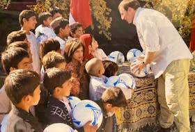 In 2007, Peter MacKay was minister of National Defence and helped deliver soccer balls to Afghan children.