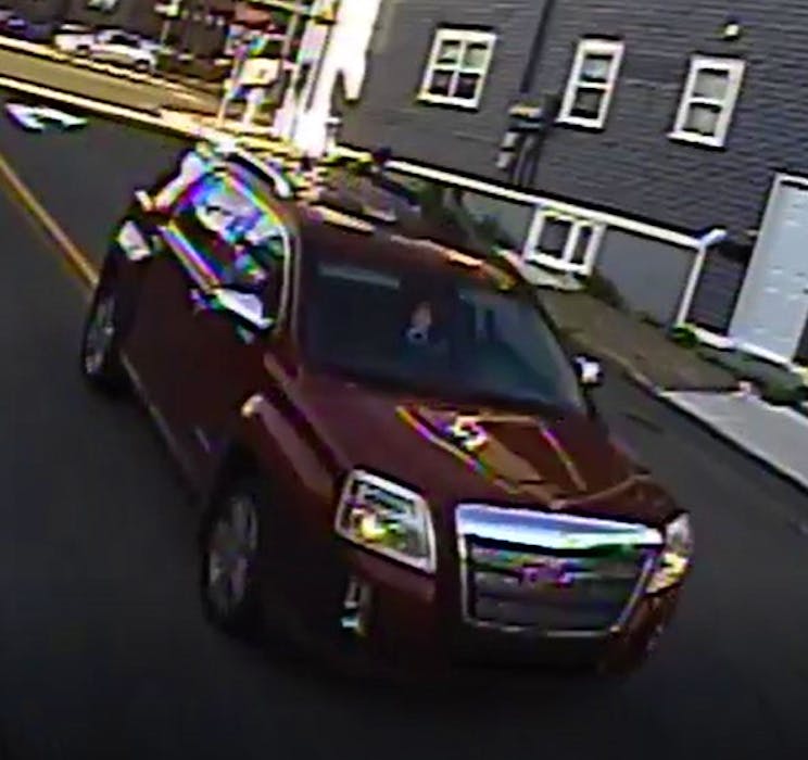 RNC homicide investigators are hoping to speak with the occupants of this red GMC Terrain, captured by CCTV cameras near the scene of the homicide of Jimmy Corcoran on Carter’s Hill in St. John’s around 6:35 p.m. on Aug. 26. Police believe they may have witnessed events that could help the investigation. — Contributed