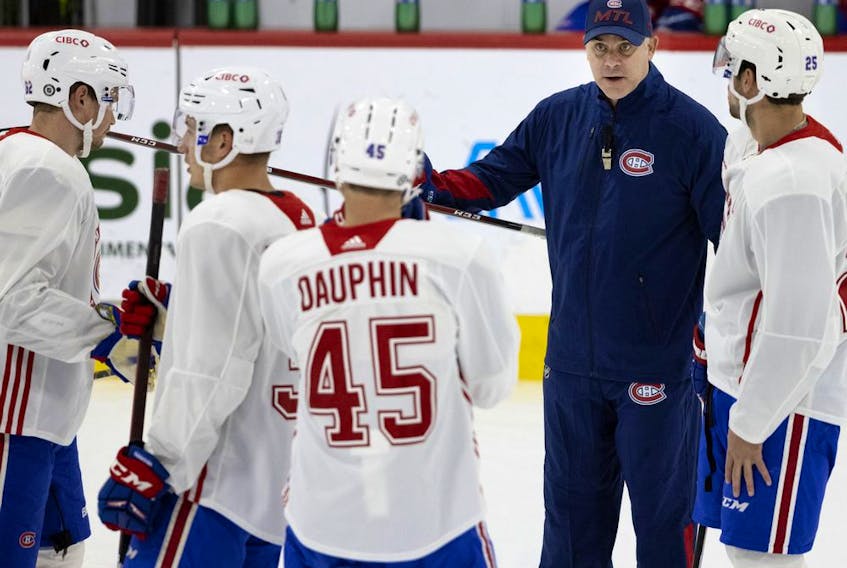 Canadiens head coach Dominique Ducharme speaks with players during practice Wednesday at the Bell Sports Complex in Brossard.