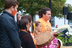 Sean Lush, right, drums and sings during a ceremony for the National Day for Truth and Reconciliation in Charlottetown.