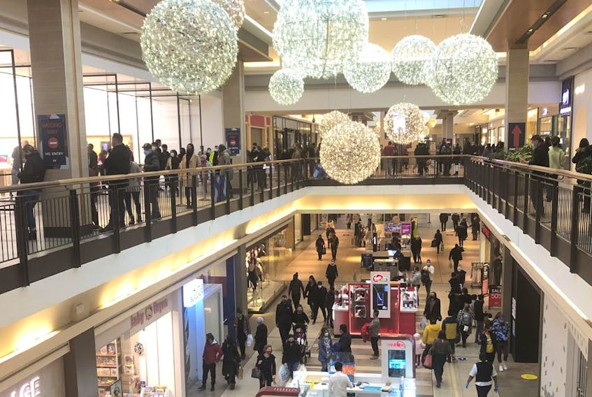 People shop at Fairview Mall in Toronto on Nov. 22, 2020. 