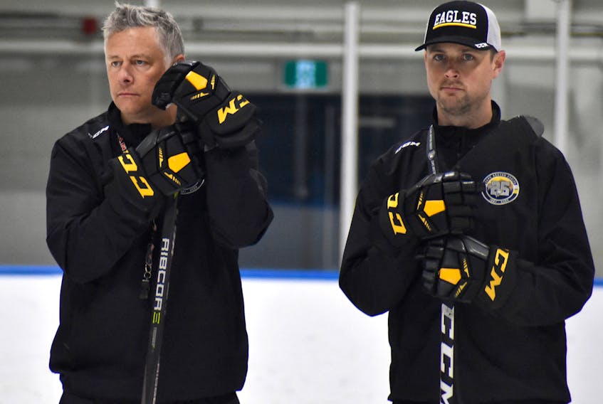 Cape Breton Eagles head coach Jake Grimes, left, watches practice with assistant coach Chris Culligan during the team’s training camp at Miners Forum in Glace Bay in August. Grimes is in his third season as the club’s bench boss. JEREMY FRASER • CAPE BRETON POST