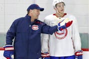  Associate coach Kirk Muller talks with young centre Jesperi Kotkaniemi during practice at the Bell Sports Complex in Brossard on Sept. 14, 2018.