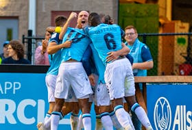 HFX Wanderers players celebrate a goal by Peter Schaale in the second half a 2-0 victory over Forge FC on Friday night at the Wanderers Grounds. - Trevor MacMillan
