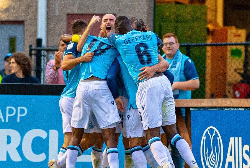HFX Wanderers players celebrate a goal by Peter Schaale in the second half a 2-0 victory over Forge FC on Friday night at the Wanderers Grounds. - Trevor MacMillan