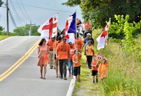 Families in the Yarmouth area, participating in a family walk on Canada Day 2021, to honour children impacted by residential schools. Nova Scotia's new holiday will serve a similar purpose, being a day of reflection on the path to reconciliation. 