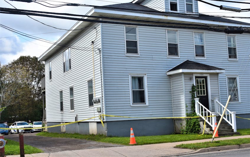 Truro Police can be seen parked in behind 494 Robie Street at approximately 11 a.m. Sunday (Sept. 5) morning. Yellow tape cordons off the building which is the scene of a suspicious death which is stated to have occurred “overnight.” - Richard MacKenzie