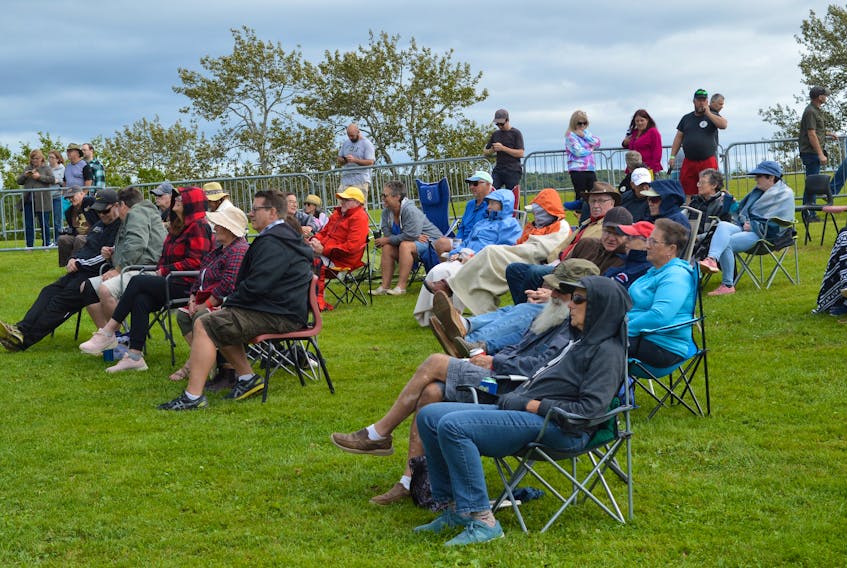People attending the Acoustic Roots Festival take in a performance on a mild Sunday afternoon at Two Rivers Wildlife Park. — IAN NATHANSON/CAPE BRETON POST 