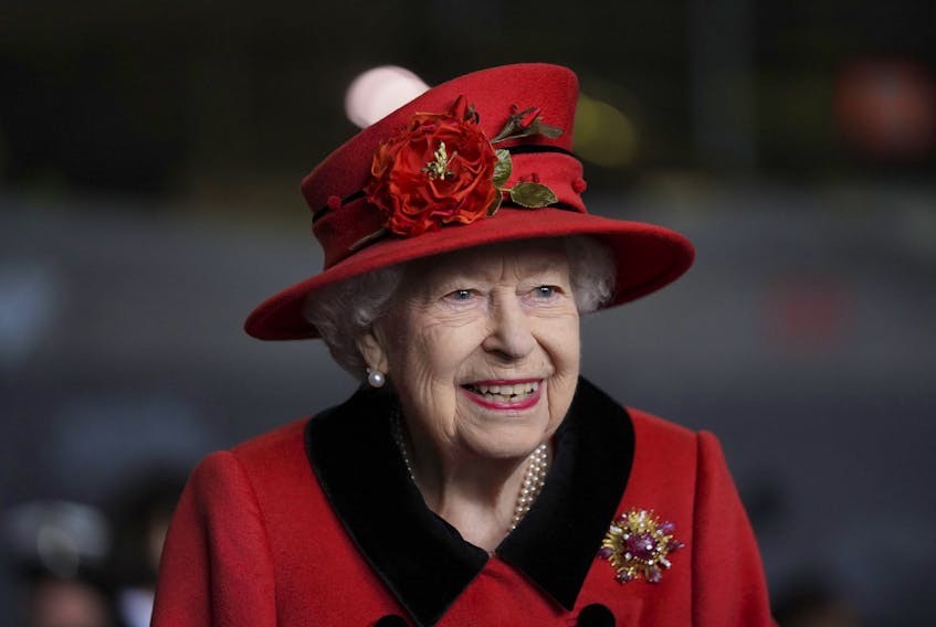 Queen Elizabeth smiles during a visit to HMS Queen Elizabeth at HM Naval Base ahead of the ship's maiden deployment on May 22, 2021 in Portsmouth, England.   