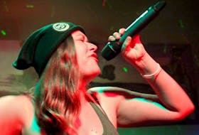 Shannon Powless (X-Plycit) raps onstage, where she says all of her social and performance anxiety disappears instantly. 