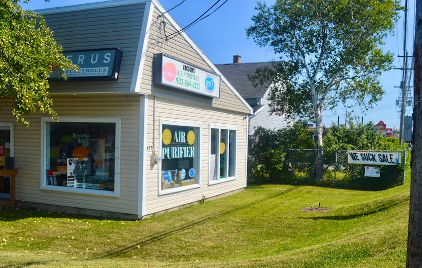 Door-to-door sales are only part of the healthy home business these days. Aerus Sydney franchise owner Ken MacDonald also operates a shop on Grand Lake Road. The “We Suck Sale” sign acknowledges the many jokes he hears about his line of work. DAVID JALA/CAPE BRETON POST - David Jala