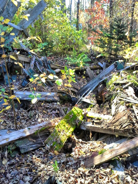 Shreds of lumber remain from the former logging and farming village. - Contributed