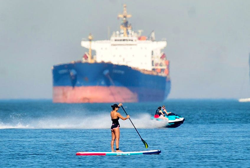 A paddleboarder in action at English Bay in Vancouver, BC., on June 27, 2021. A large group of paddleboarders were rescued on Labour Day after trying to cross English Bay. 