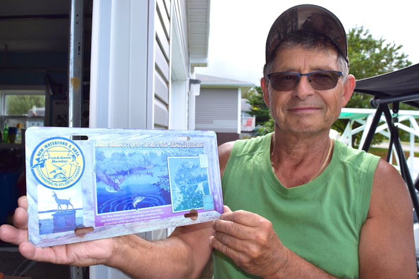 Charlie McPhee, a member of the New Waterford Fish and Game Association, holds one of many license plates he made many years ago in celebration of the New Waterford Fish and Game Sportsmen’s Memorial Park, that included the iconic deer statue. McPhee said after all these years he’s happy to see the statue back. Sharon Montgomery-Dupe/Cape Breton Post

 - Sharon Montgomery