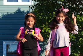 Zayna (left) and Ghrita Guerche on their first day of school on Wednesday morning. The sisters and their mother joined their father, who has been living and working as a chef in Newfoundland and Labrador for a few years, when they moved from Morocco in May 2021. They speak Arabic and French, so will be attending one of the French schools in St. John's, as their parents think this is the best way for them to move forward with their education. However, they've already learned a lot of English over the summer from playing games like hide and seek and tag and swimming with their new friends this summer.