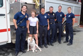 Skyler Blackie's friends and family. From left to right: Brother and firefighter Errison Blackie, K9 pal Bella, wife Erin Blackie, firefighter Craig Matthews, fire chief Blois Currie, firefighter Shawn Creelman and firefighter Tom Malone.