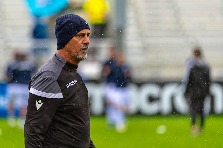 HFX Wanderers head coach Stephen Hart surveys the scene at a wet Wanderers Grounds prior to his team's match against York United on Monday afternoon. - Trevor MacMillan / Canadian Premier League