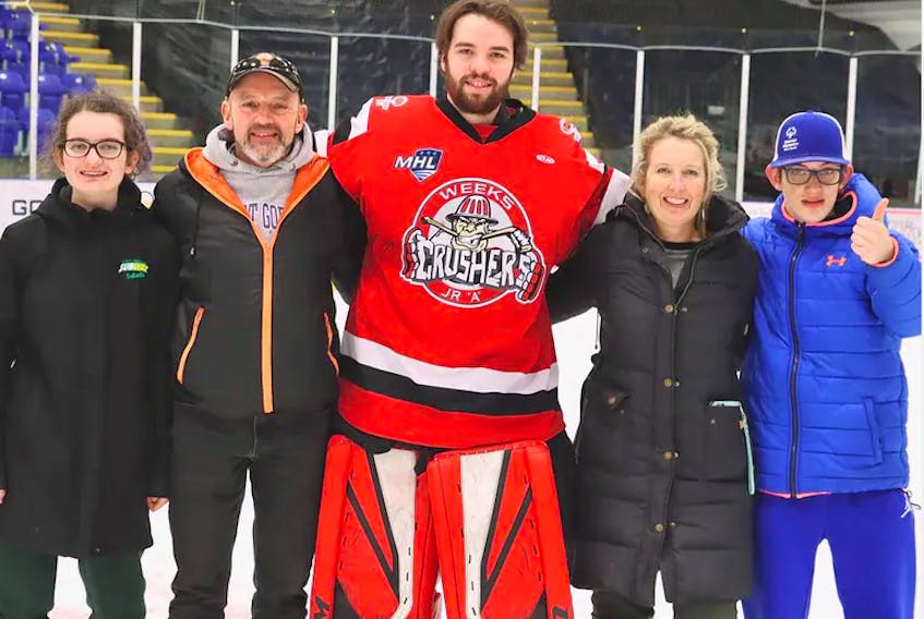 The Tulloch family – Alexis, Kevin, Heather and James – are pictured with Weeks Crushers goalie Lucas Park, who billeted with them last season. JENNIFER WEEKS PHOTO - Contributed