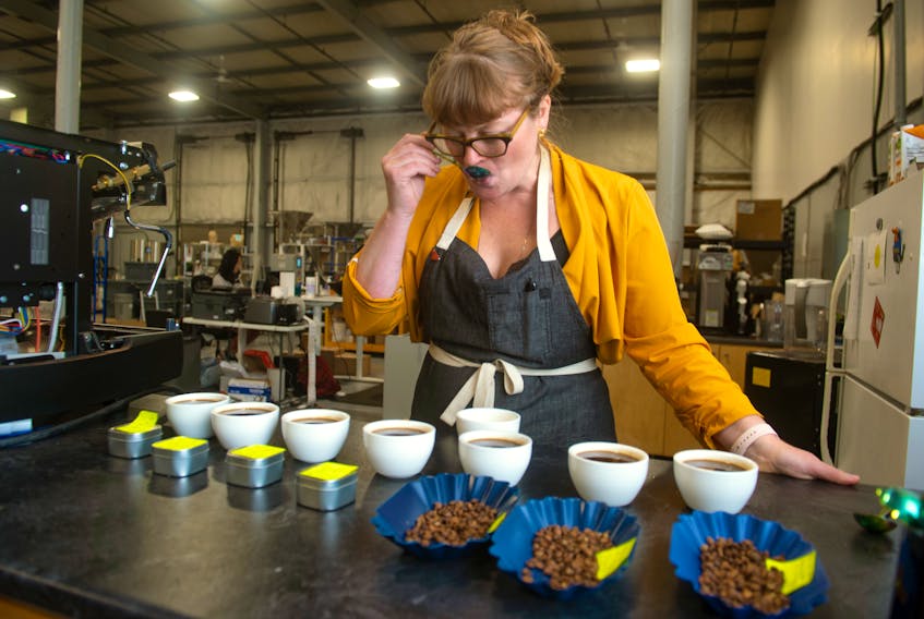 Liz Bishop, director of coffee at Java Blend, samples different coffees at the company's facility in Dartmouth on Thursday, Sept. 9, 2021.