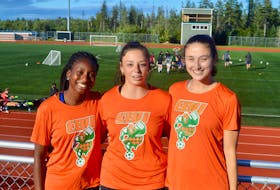 The Cape Breton Capers women’s soccer team is looking to make it four consecutive AUS championship titles as they prepare for a return to action following the cancellation of the 2020 season. This year’s team captains are shown squinting into the bright sunshine of an early September afternoon training session. From left, defender Fatou Ndiaye, midfielder Amelia Carlini and defender Madison Lavers. DAVID JALA/CAPE BRETON POST