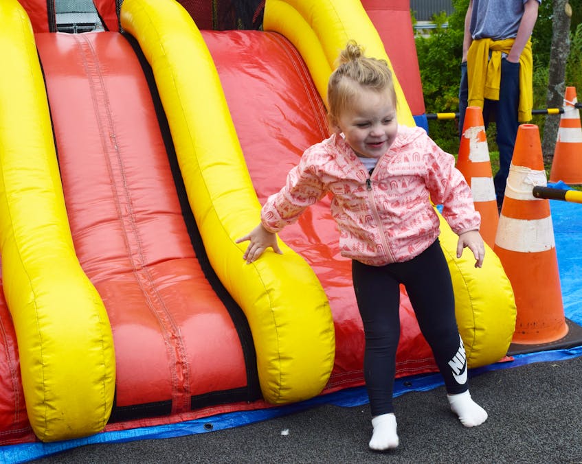 Ellen Warren, 3, enjoyed going down an inflatable that was set up as part of activities in Westville. - Adam MacInnis