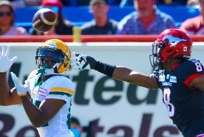 The Edmonton Elks' Earnest Edwards makes a touchdown catch in front of Stampeders DB DaShaun Amos during Monday's Labour Day Classic at McMahon Stadium in Calgary.