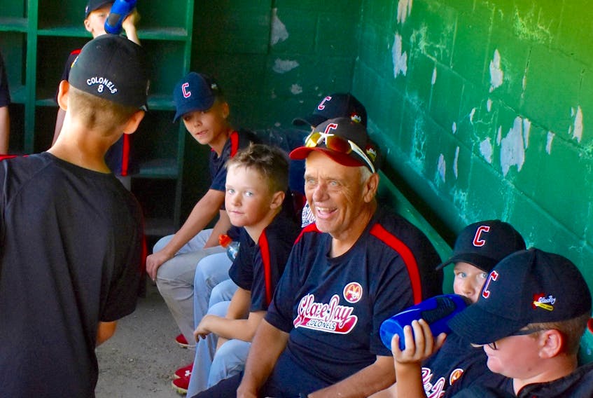 In this 2019 file photo, the late Henry Boutilier, middle, is shown in the dugout with members of the Glace Bay McDonald’s Colonels at the Cameron Bowl in Glace Bay. The longtime coach died late last year after a battle with cancer. DAVID JALA/CAPE BRETON POST