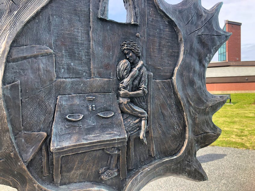 The other side of the memorial sculpture is a picture of a mother with her child, waiting for a miner to come home. NICOLE SULLIVAN/CAPE BRETON POST