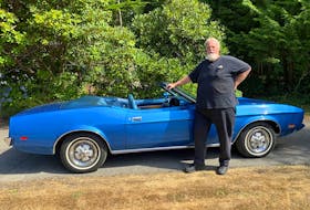 Dave Mitchell with the 1973 Mustang convertible he bought in California to commemorate the Insurance Corporation of British Columbia’s 25th anniversary. Alyn Edwards/Postmedia News