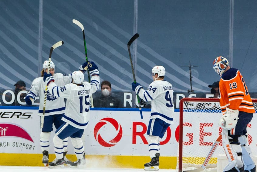 The Toronto Maple Leafs’ William Nylander (88) celebrates a goal with teammates on Edmonton Oilers goaltender Mikko Koskinen (19) at Rogers Place in Edmonton on Monday, March 1, 2021.