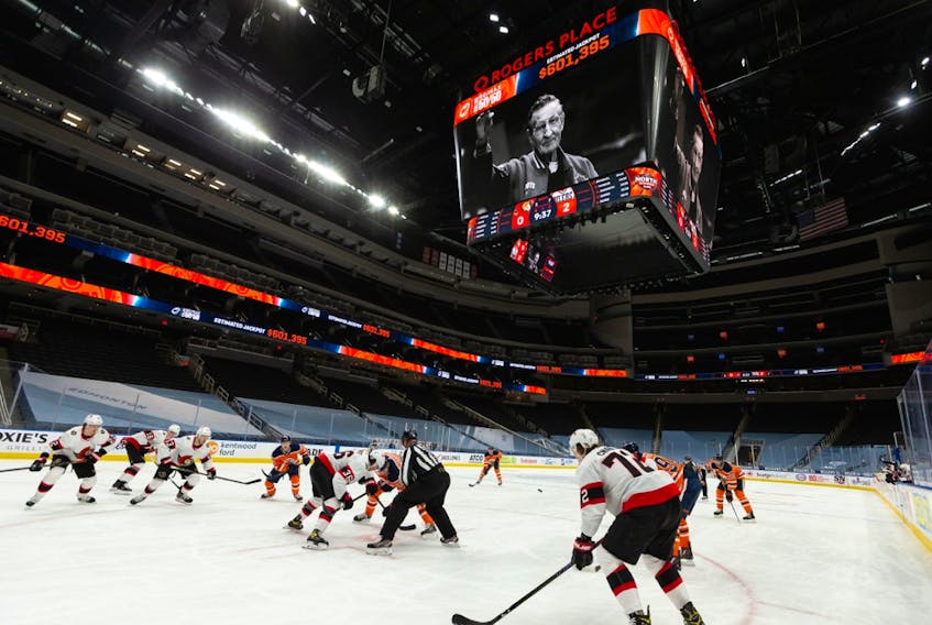 Walter Gretzky waves on the big screen as the Edmonton Oilers 50-50 raffle for Edmonton’s Food Bank is dedicated to Wayne Gretzky’s father, seen during an Edmonton Oilers and Ottawa Senators NHL game at Rogers Place in Edmonton, on Wednesday, March 10, 2021.