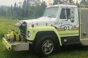  The Mussfelds bought a decommissioned fire truck to help put out the massive forest fire behind their house in Criss Creek.