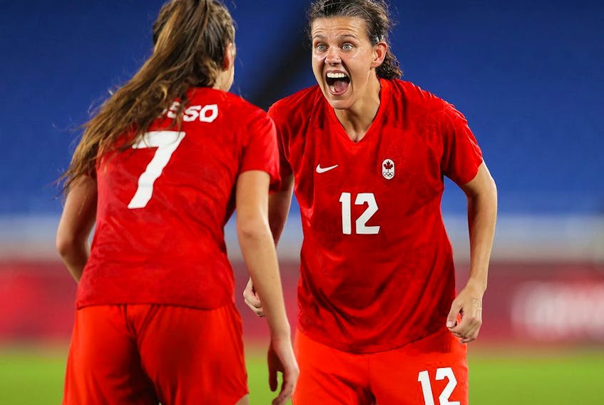  Christine Sinclair (right) celebrates with teammate Julie Grosso after Canada beat Sweden to win the country’s first Olympic gold medal in soccer at the Tokyo 2020 Games.