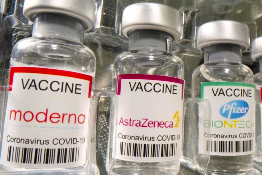Vials labelled "Moderna, AstraZeneca, Pfizer - Biontech coronavirus disease vaccine" are seen in this illustration picture taken May 2, 2021.