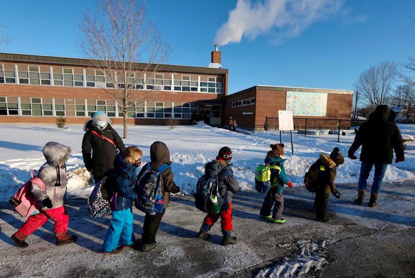 Students return to in-class learning earlier last year after a four-week COVID-19 shutdown at Vincent Massey Public School 