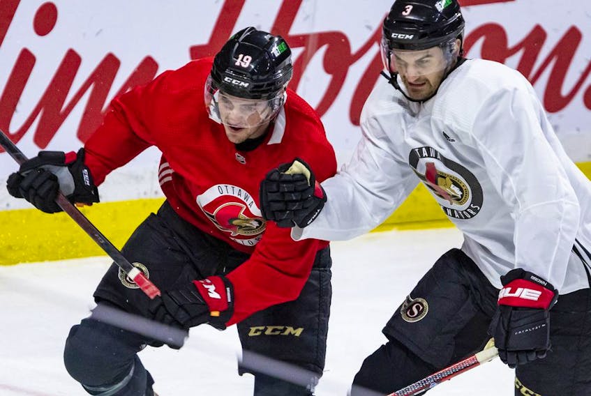 Ottawa Senators forward Drake Batherson (left) and defenceman Josh Brown during the team's practice at the Canadian Tire Centre. on Thursday.