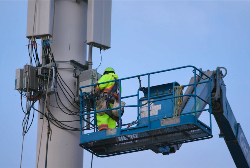 A technician with Bell Canada works on the network to add 5G service in this handout photo provided by the company.