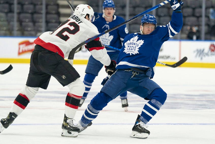 Senators defenceman Thomas Chabot (72) battles with Toronto Maple Leafs right wing Ondrej Kase. Kase could be back in the lineup tonight against Vegas. 
