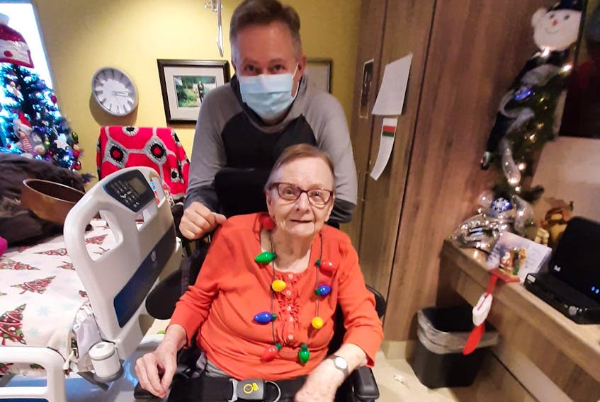 David Coish of St. John’s with his mother, Bertha Coish, at the Western Long-term Care Home in Corner Brook. Bertha Coish is waiting to receive her COVID-19 booster, and her son is questioning why it’s taking so long.