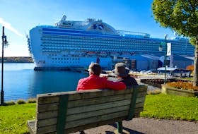 Cruise ship passengers enjoy a minutes on a Sydney boardwalk bench before returning to their vessel during a November 2017 visit to the Cape Breton port. DAVID JALA/CAPE BRETON POST