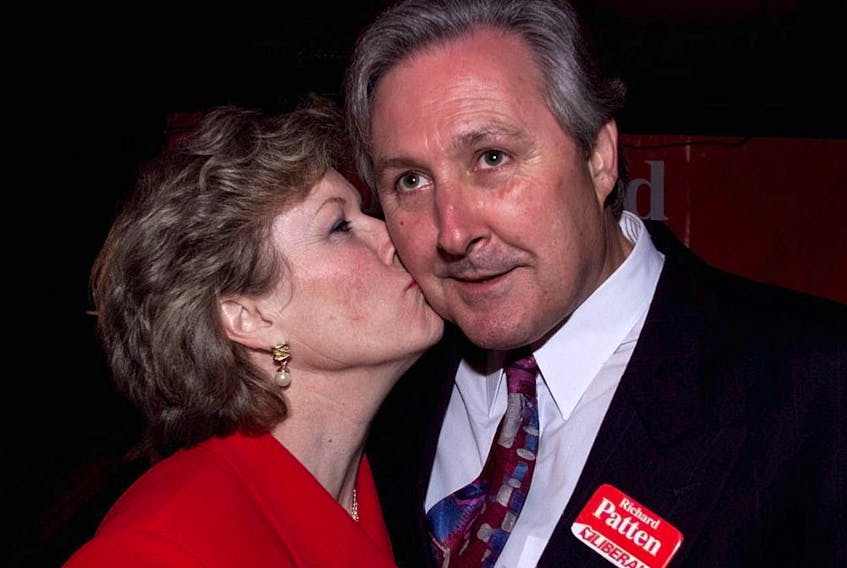  Files: Ottawa South Liberal winner Richard Patten gets a kiss from his wife, Penny.