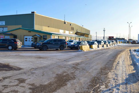 Vehicles line up at the COVID-19 testing clinic in Charlottetown on Jan. 11.Earlier that day the province announced 304 new cases in P.E.I. 