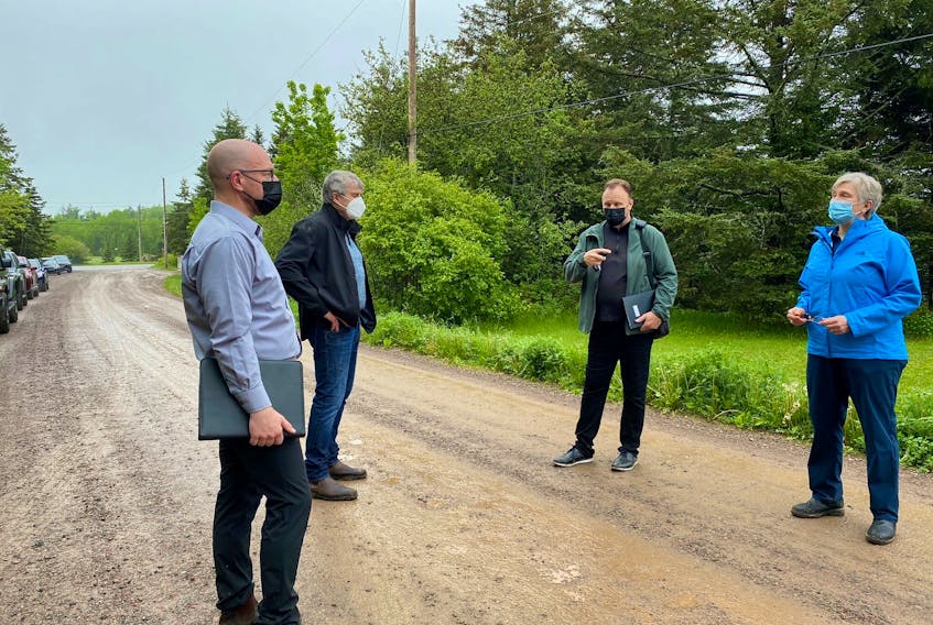 Mass Casualty Commission investigations director Barbara McLean talks to members of her team during a tour of the Portapique area in June 2021. The commission will begin public proceedings next month.