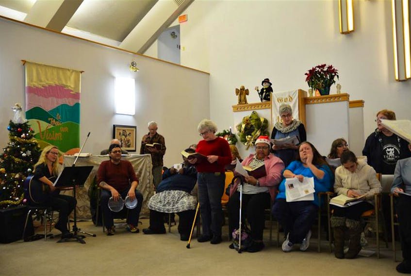 Carol Charlebois, standing middle, with the Shining Lights Choir, for homeless folk, which she co-founded, was a tireless worker in her role as  executive director at Metro Non-Profit Housing Association.  Charlebois recently passed away. - Contributed