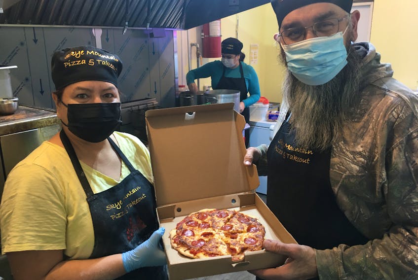 Tina and Leonard Bernard of We'koqma'q First Nation made their dream of opening a pizza shop a reality earlier this month with help from their family, including daughter, Amber Bernard, centre. ARDELLE REYNOLDS • CAPE BRETON POST
