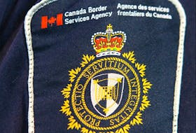 A Canadian Border Services Agency (CBSA) officer's shoulder flash is shown at the Calgary Courts Centre is shown in Calgary, Alta on Saturday April 22, 2017. (Jim Wells//Postmedia Network)