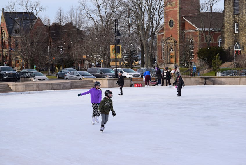Skaters enjoying the downtown ice at Civic Square in Truro.