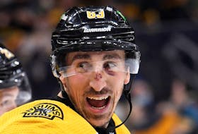 Boston Bruins left-winger Brad Marchand reacts after scoring his first goal during the first period against the Montreal Canadiens at TD Garden on Wednesday.